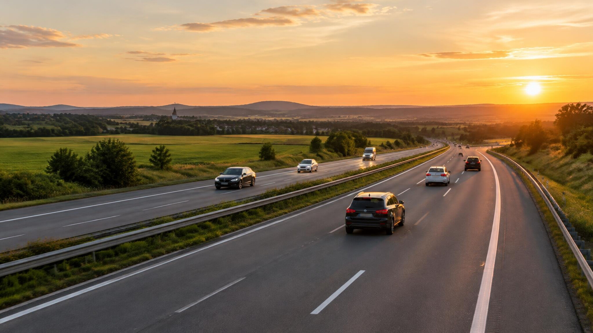 Cars driving on a motorway at golden hour